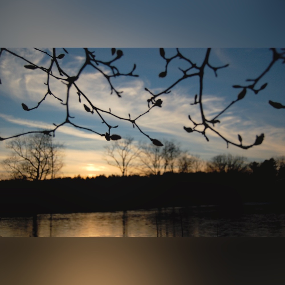 Atmospheric landscape photo print of a winter wonderland seen by side of river